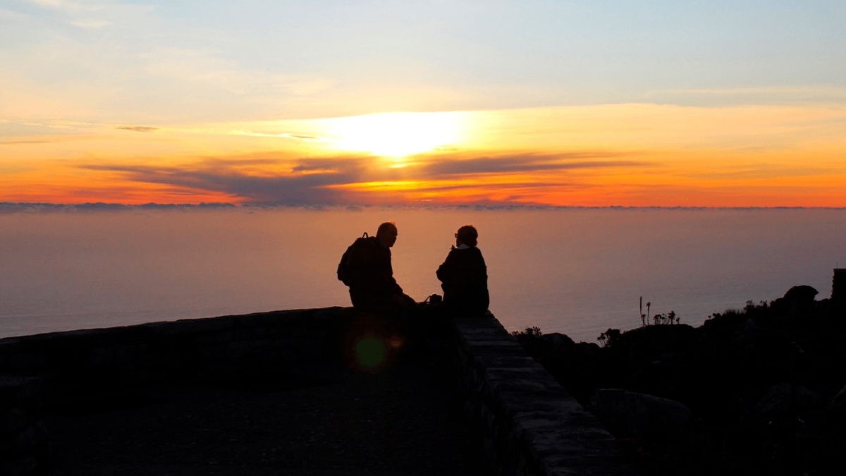 Silhouette of a couple on top of Table Mountain