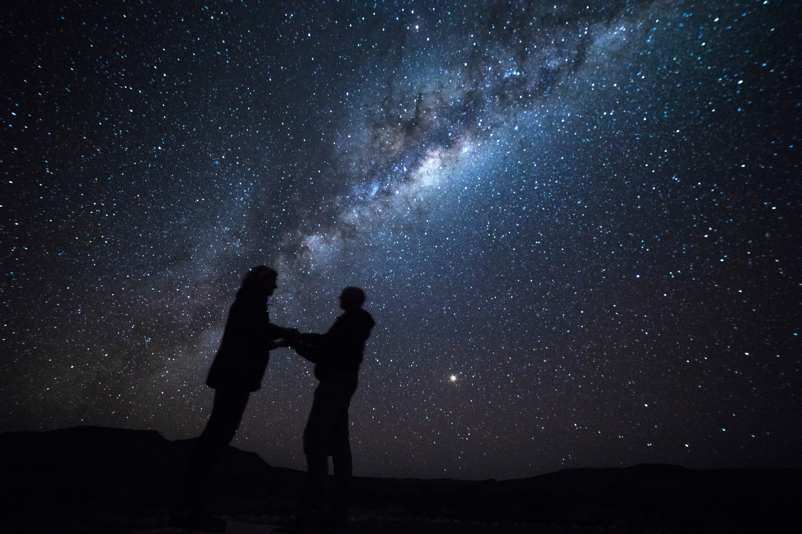 Couple proposing under Milky Way